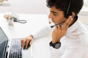 Managed IT services support technician taking a helpdesk call