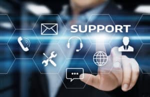 A person touches a virtual screen with hexagonal icons for support—phone, email, tools, headset, chat, globe, and user—emphasizing "SUPPORT" as the focal point while showcasing bundling IT services for seamless assistance.