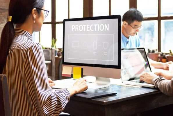 woman on computer that says protection